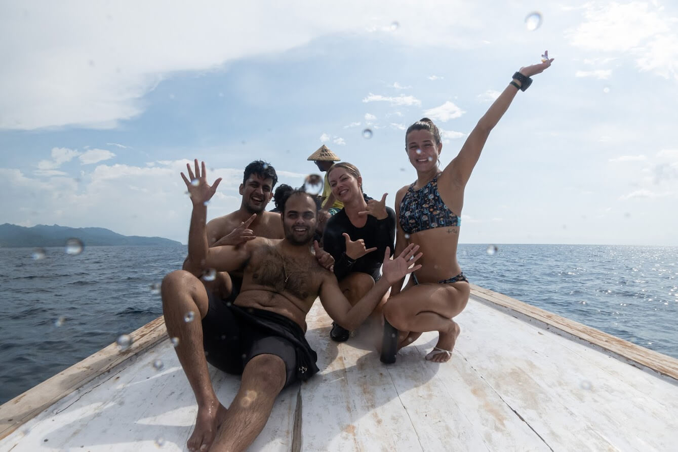 Group of happy divers on a boat