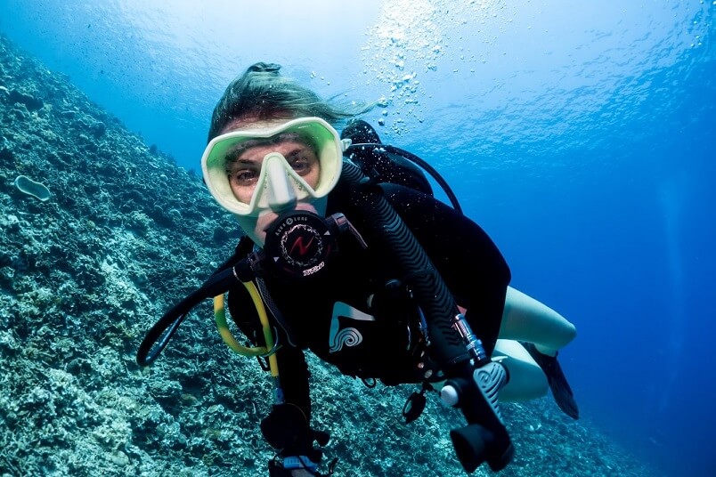 Female diver with a green mask